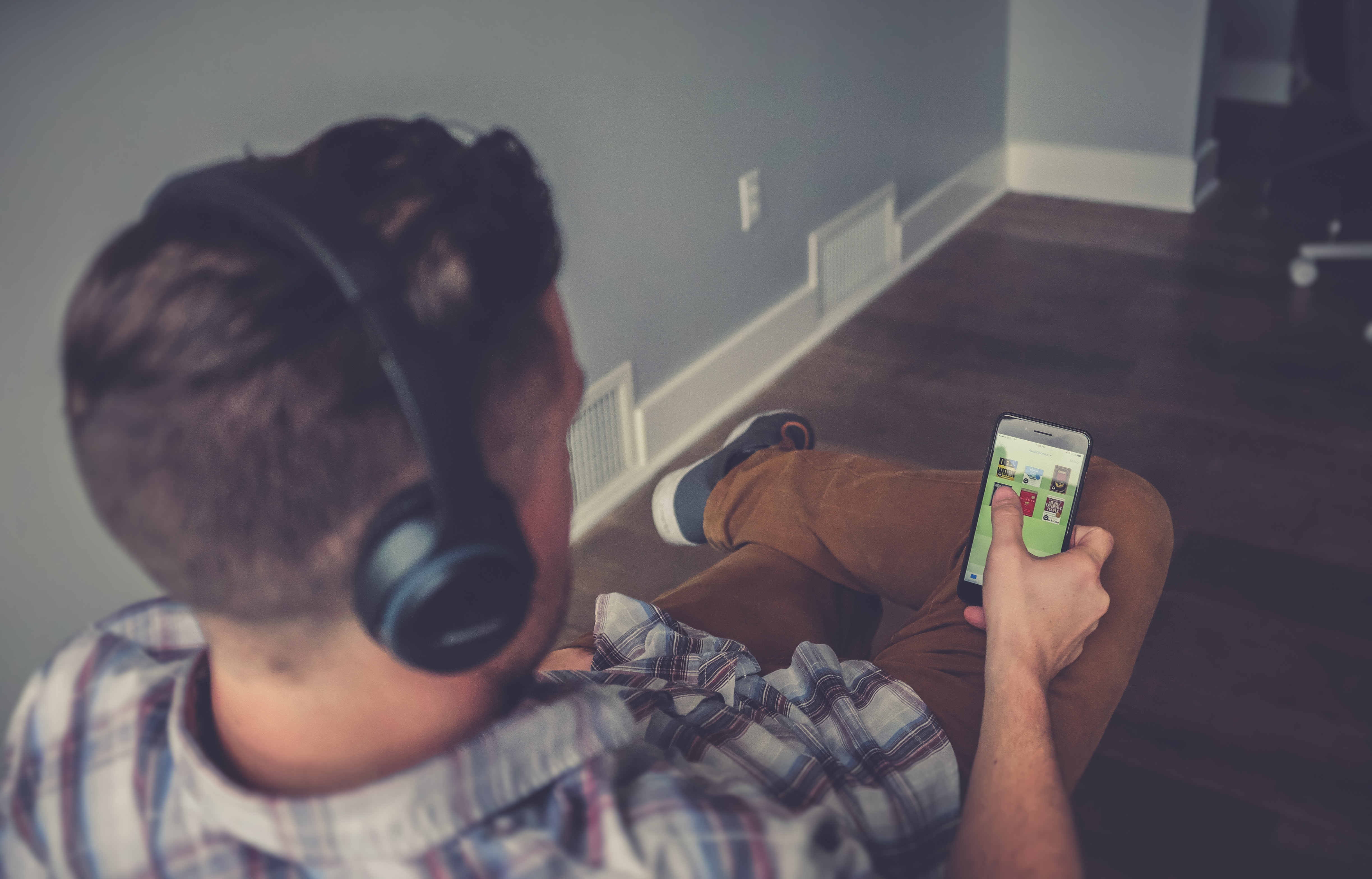 Man listening to audio with headphones